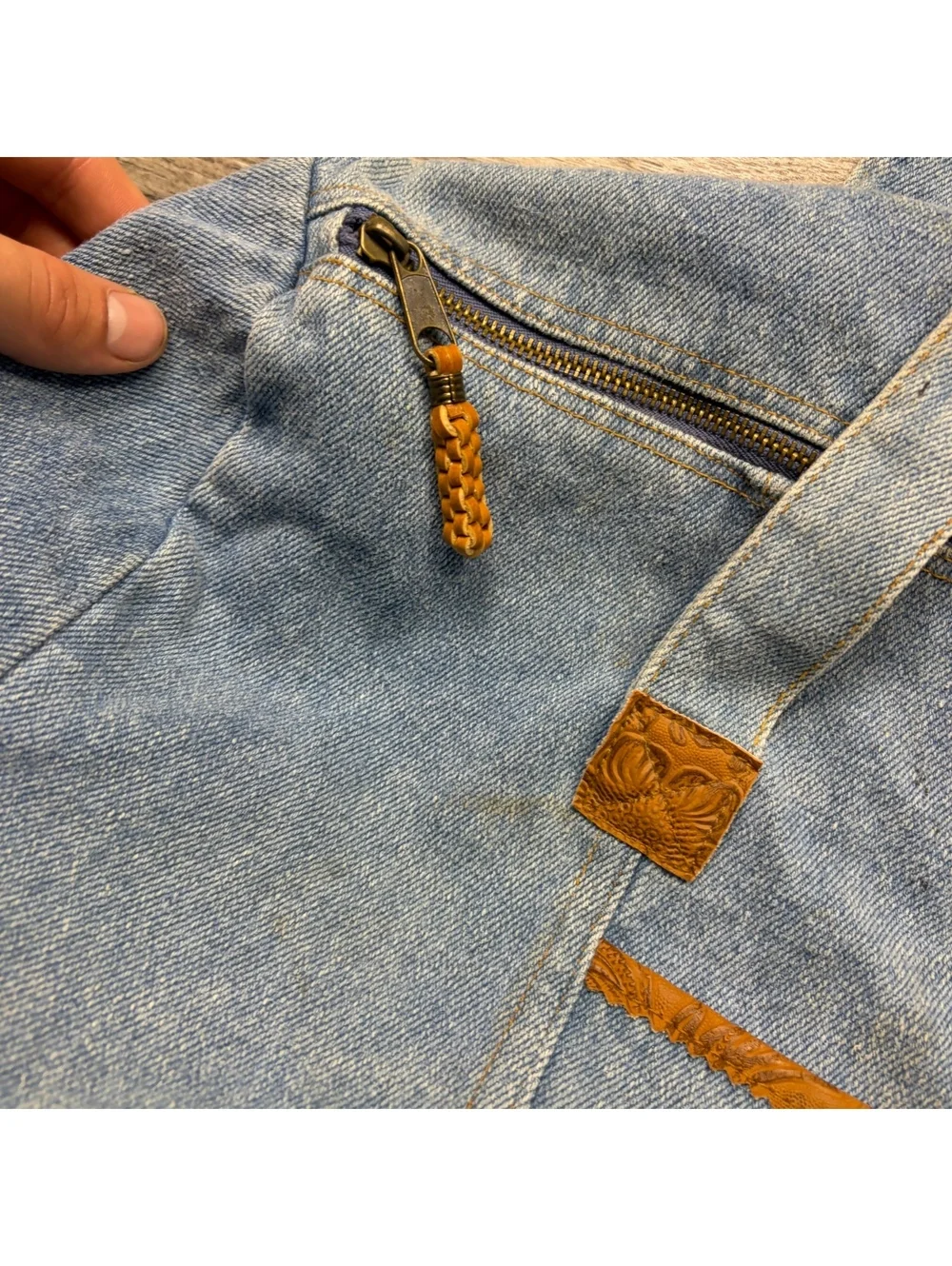 Vintage denim duffel bag, stains throughout but no distressing